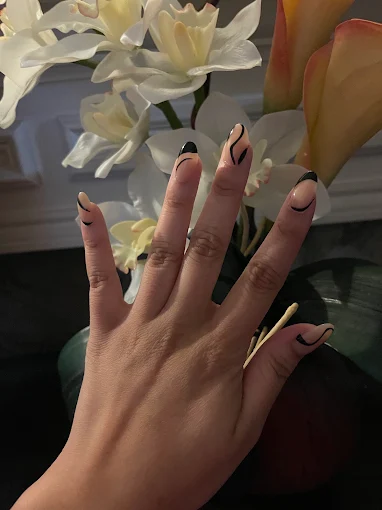 Neutral almond nails with minimal black line art
